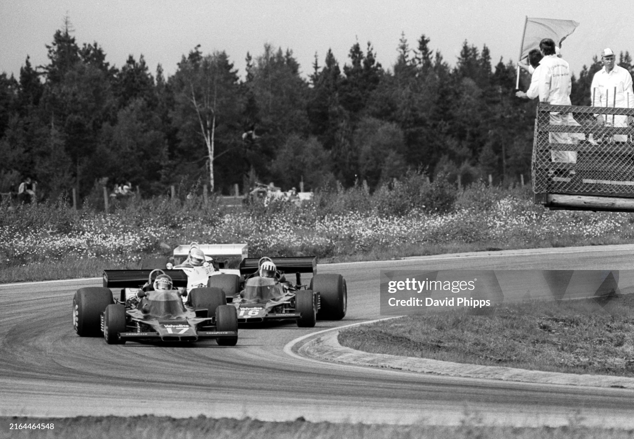 Twelfth placed Jean-Pierre Jarier, Shadow DN5B, leads his team mate, ninth placed Tom Pryce, as a yellow flag is waved by a marshal from his gantry at the Grand Prix of Sweden in Anderstorp on 13 June 1976. 
