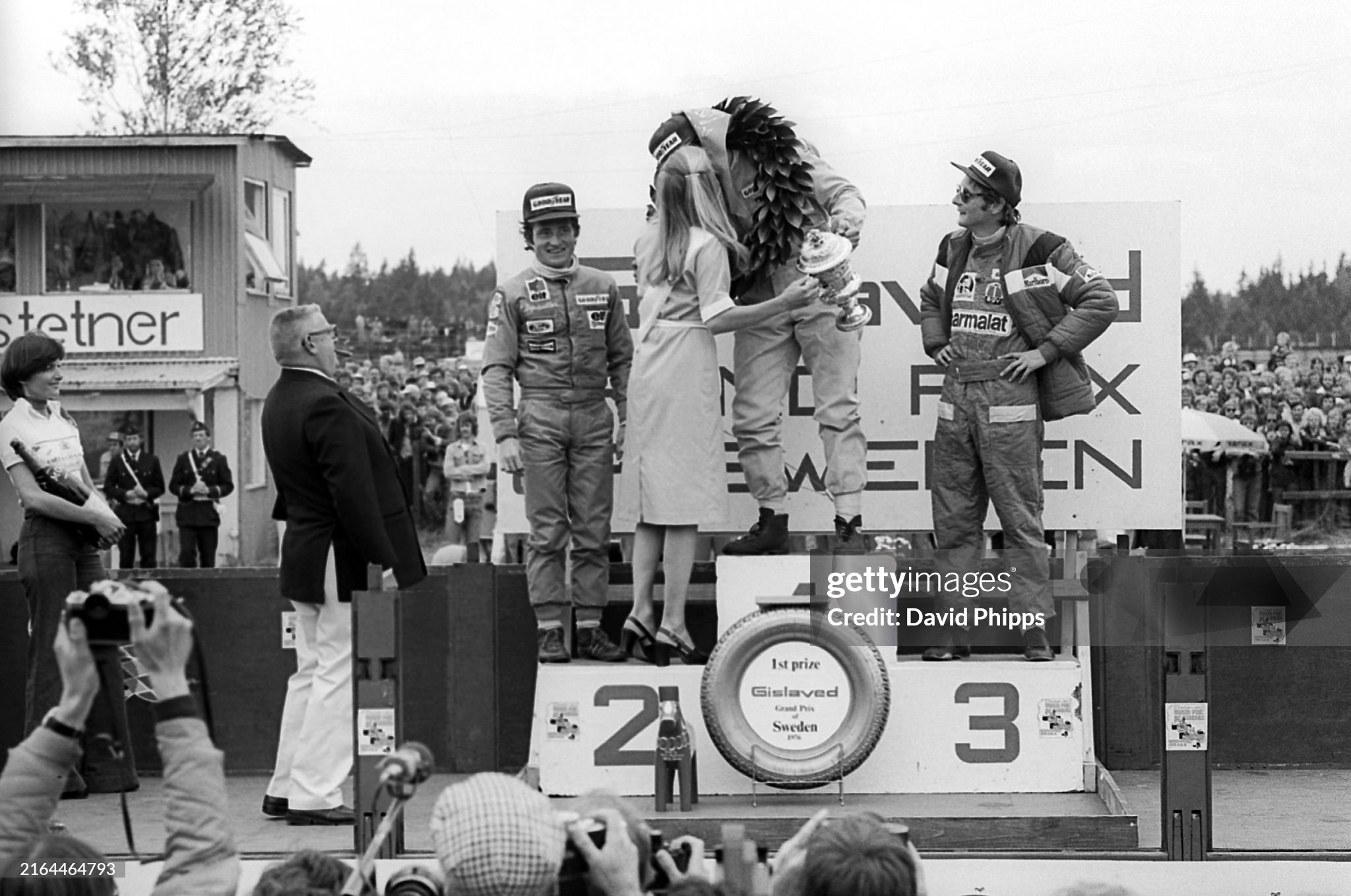 The podium of the Grand Prix of Sweden in Anderstorp on 13 June 1976: Patrick Depailler, Tyrrell, second; Jody Scheckter, Tyrrell, race winner; Niki Lauda, Ferrari, third. 