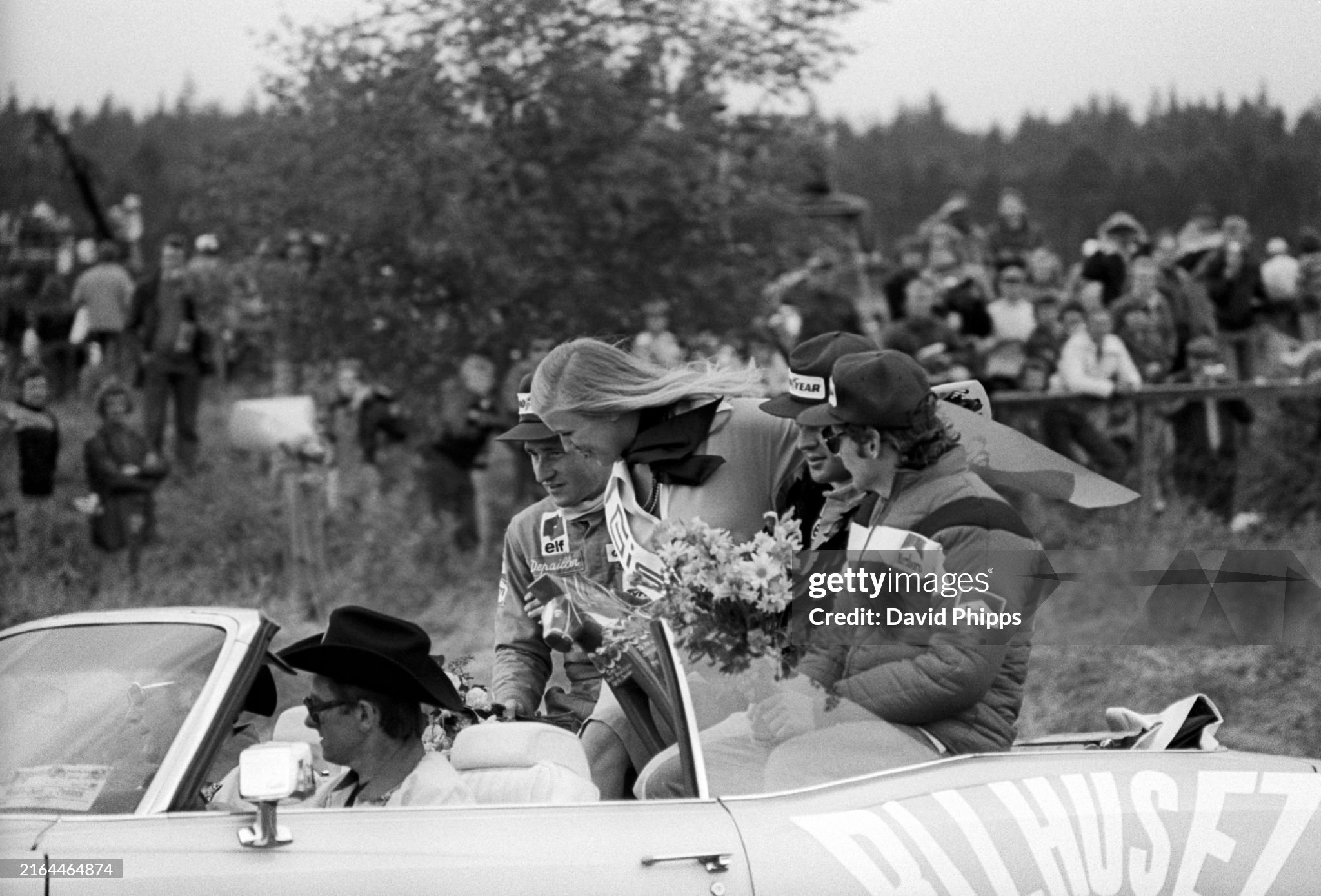 The podium finishers head out on the back of a car for a celebratory lap of the Anderstorp circuit on 13 June 1976. 