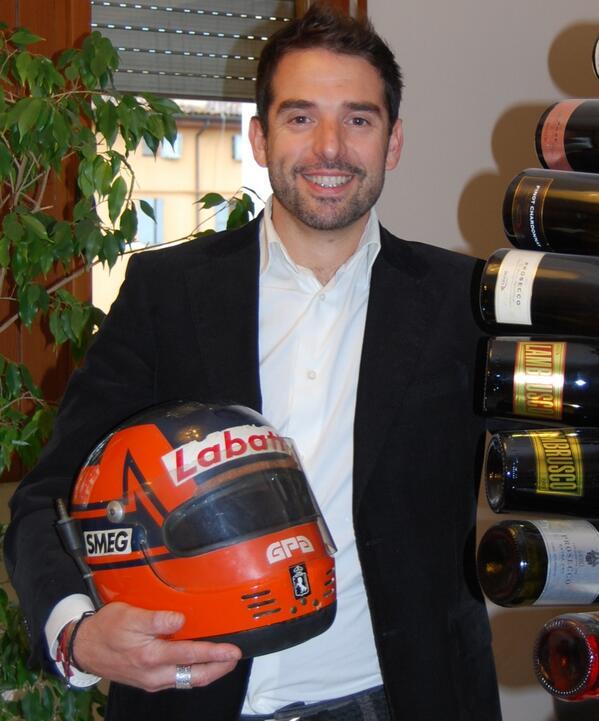 Jonathan Giacobazzi with the helmet of Gilles Villeneuve.