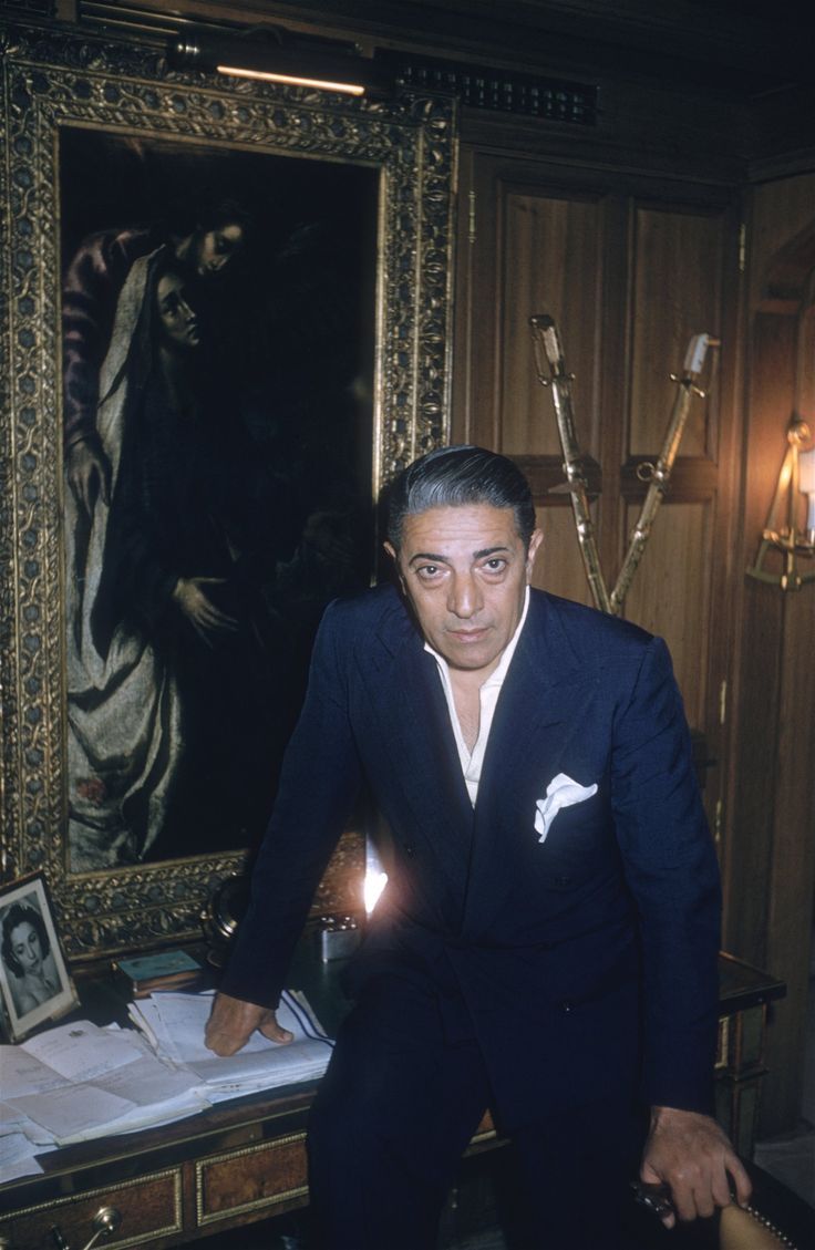 Greek shipping magnate Aristotle Onassis in the office aboard his yacht 'Christina' in August 1956. 