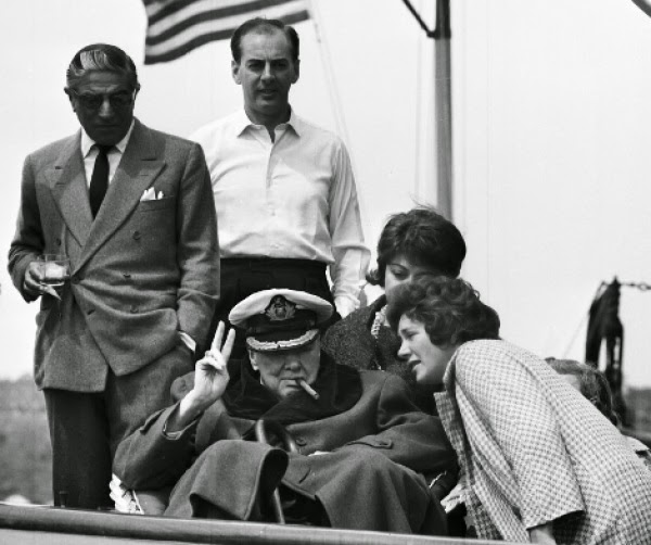 Aristotle Onassis aboard his yacht 'Christina' with some guests.