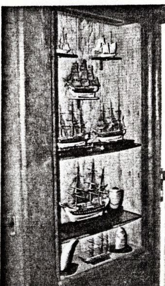A display cabinet with models of ancient ships inside the yacht 'Christina'.