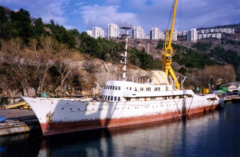 A rusting 'Christina' at anchor.