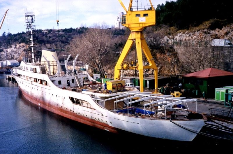A rusting 'Christina' at anchor.