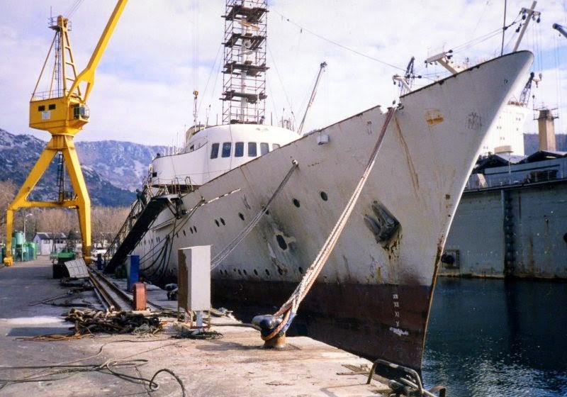 A rusting 'Christina' at anchor.