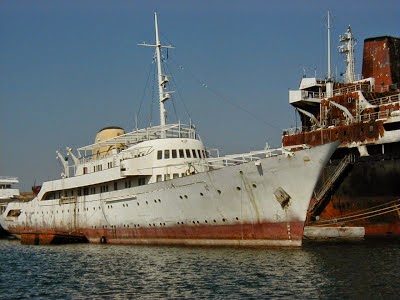 A rusting 'Christina' at anchor.