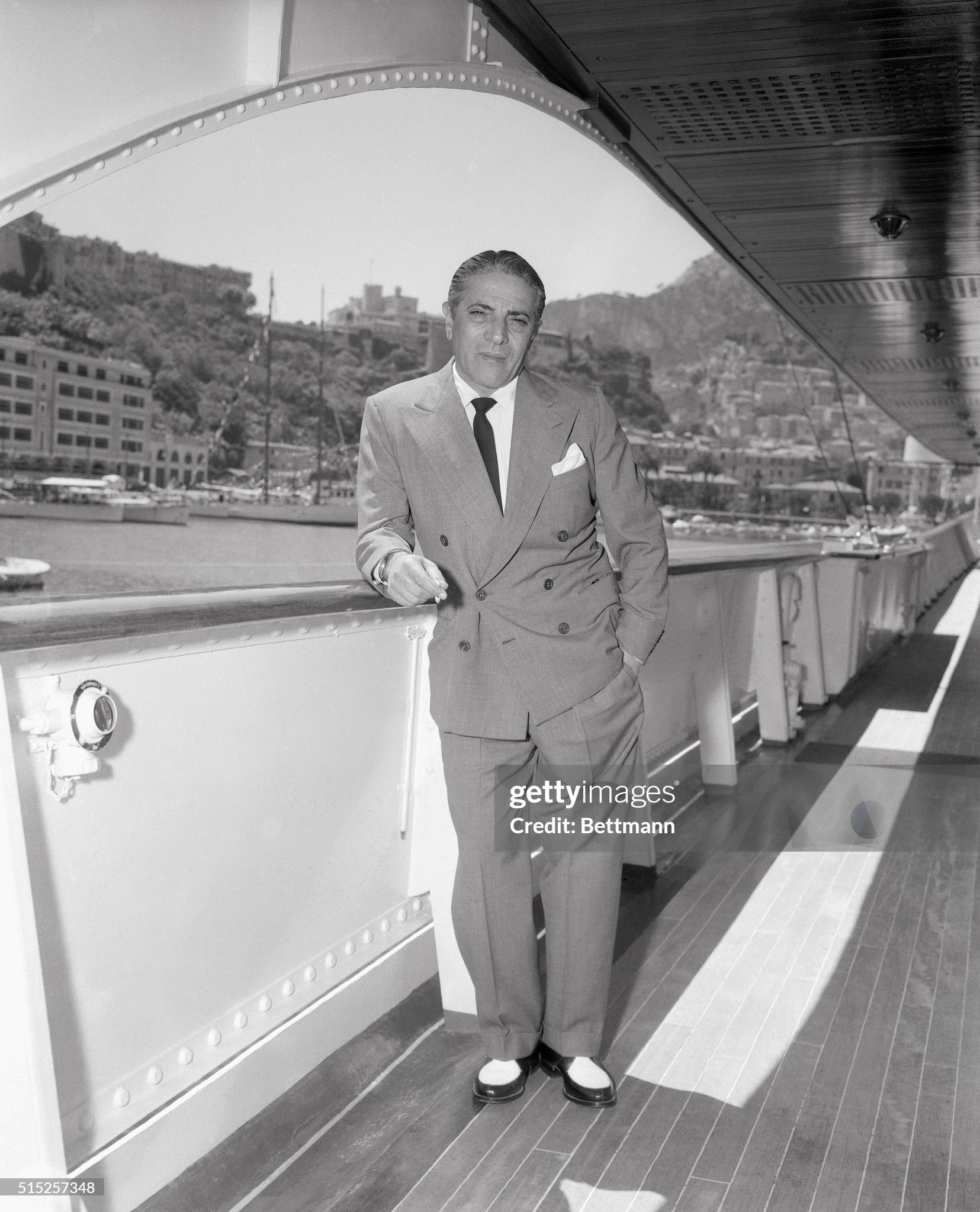 Aristotle Onassis leaning on railing of his yacht ‘Christina’ on May 22, 1955. 