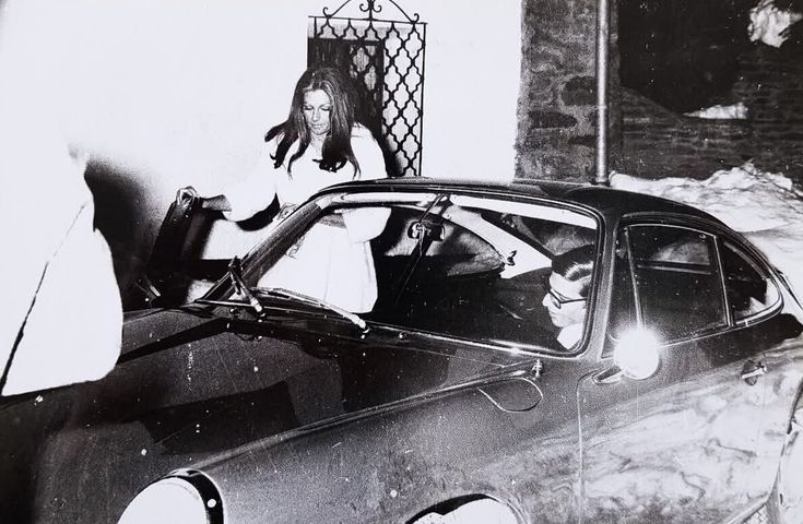 Alexander Onassis in his Porsche with Fiona von Thyssen.