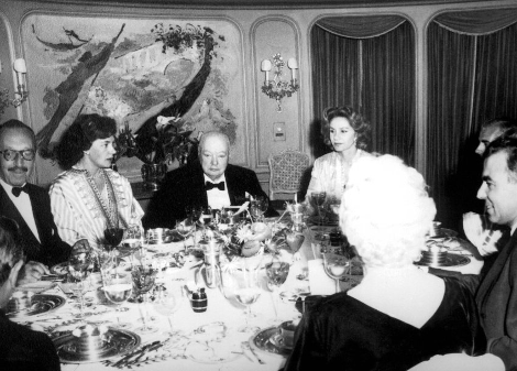 Winston Churchill having dinner aboard the ‘Christina’.