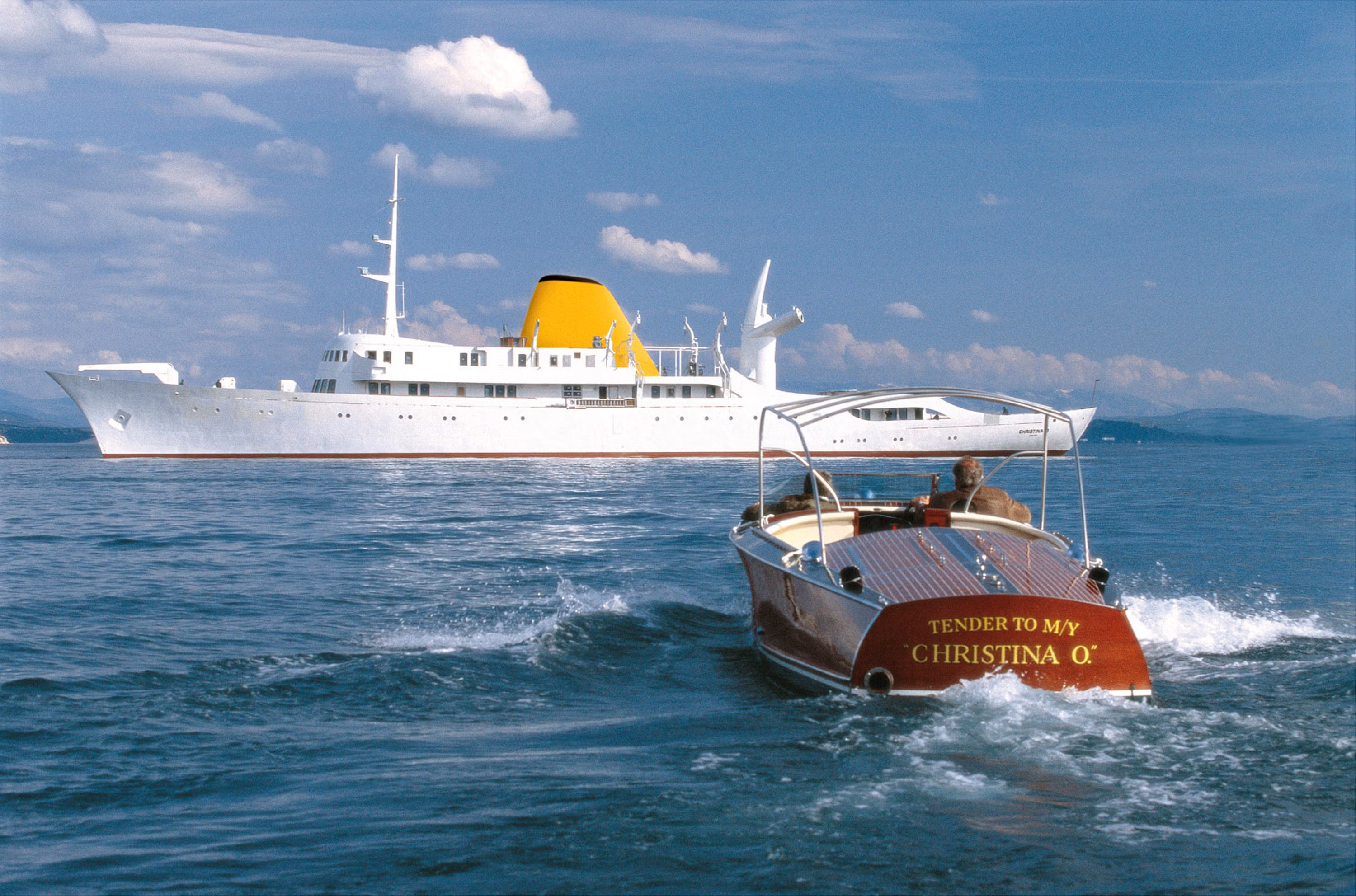 The newly restored Christina O’, former private yacht of Aristotle Onassis and her tender cruise at sea on 24 April 2001. 