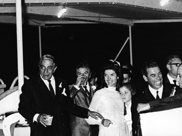 Jaqueline Kennedy Onassis, embracing her daughter Caroline Kennedy and her new husband, Greek shipping magnate Aristotle Onassis, hold a reception aboard the yacht Christina shortly after their wedding ceremony on the Island of Skorpios, Greece, on 21 October 1968.