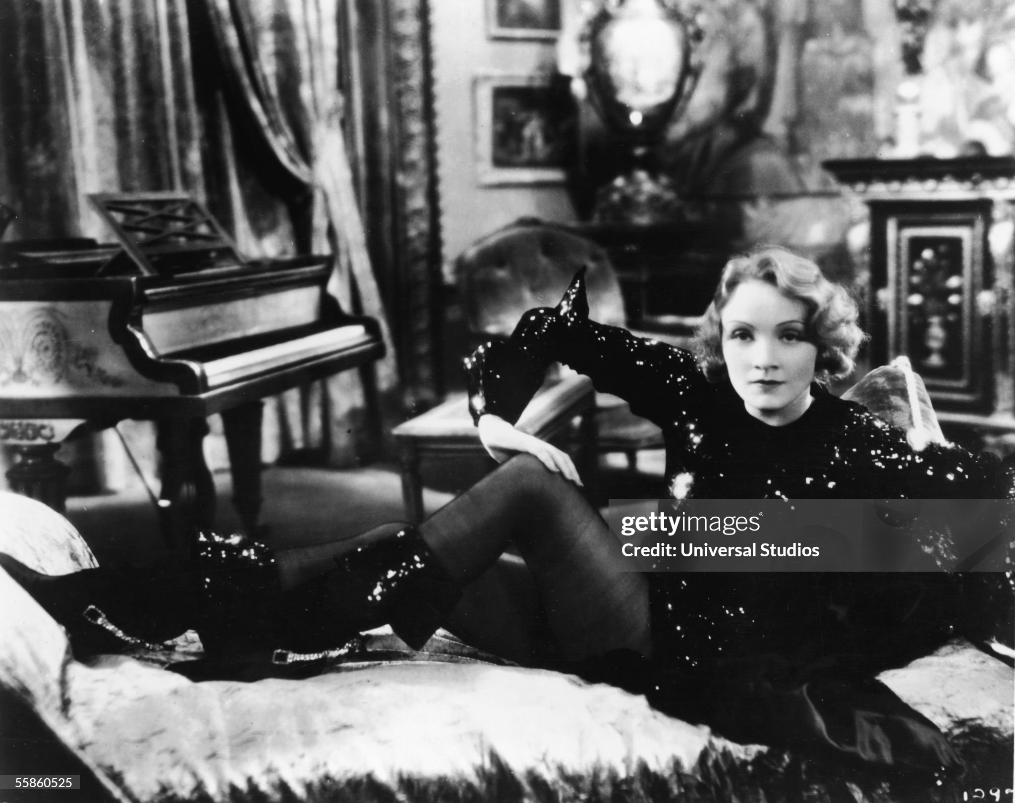 German actress Marlene Dietrich (1901 - 1992) lounges on a daybed in a scene from the film 'Dishonored', directed by Josef von Sternberg, Los Angeles, California, 1931. 