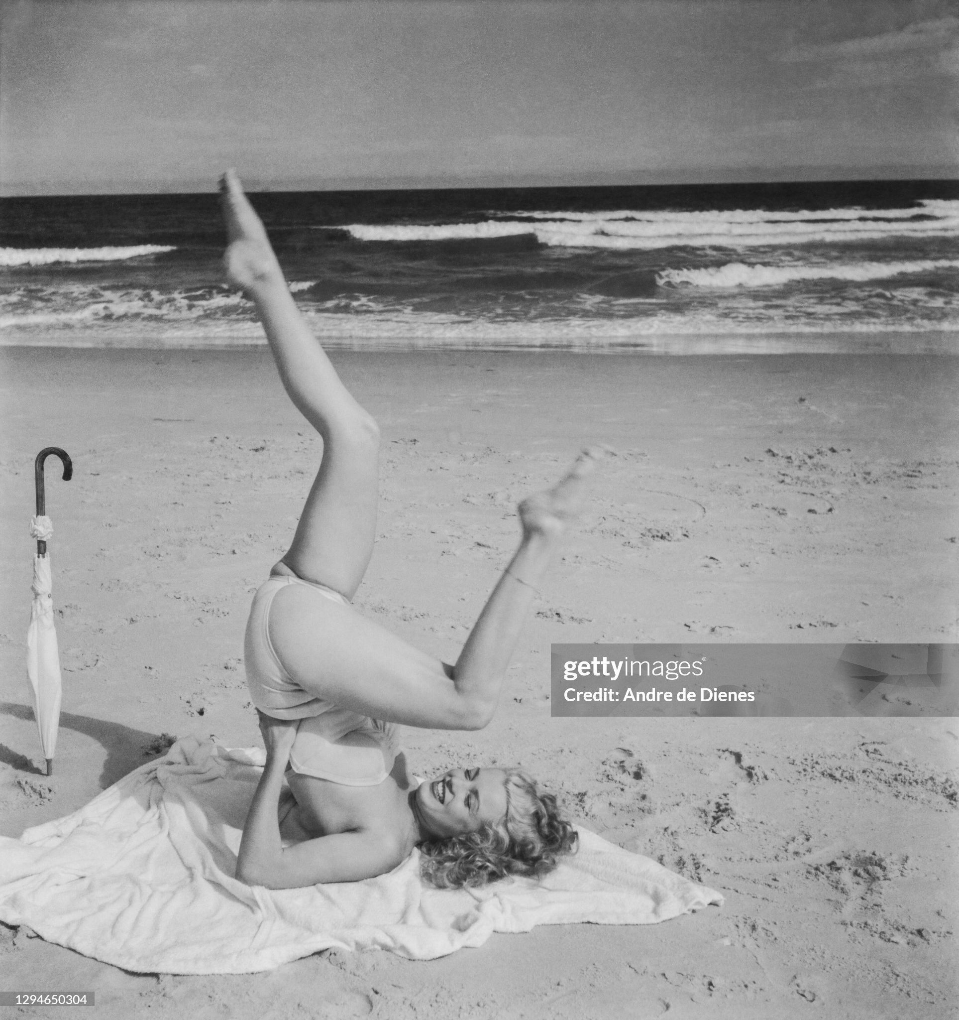 Marilyn Monroe in a swimsuit, as she poses, lying on a blanket, on Long Island's Tobay Beach, Oyster Bay, New York, in 1949. 