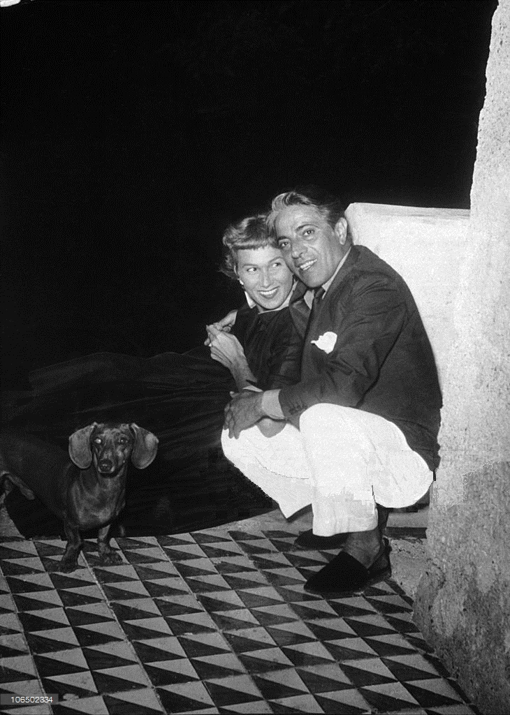 Two young Aristotle and Tina Onassis with their dog.