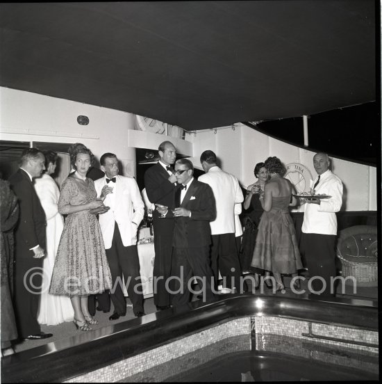 Aristotle Onassis at a cocktail party on his yacht Christina in the Monaco harbor in 1954. 