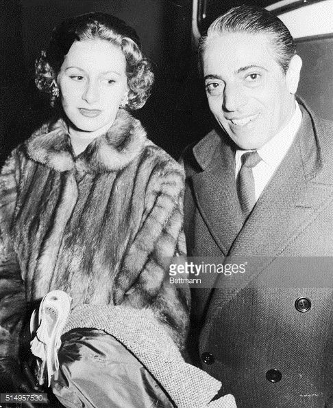 Aristotle Onassis and his wife Athina at Heathrow Airport in London before boarding their plane on 12 January 1954. 