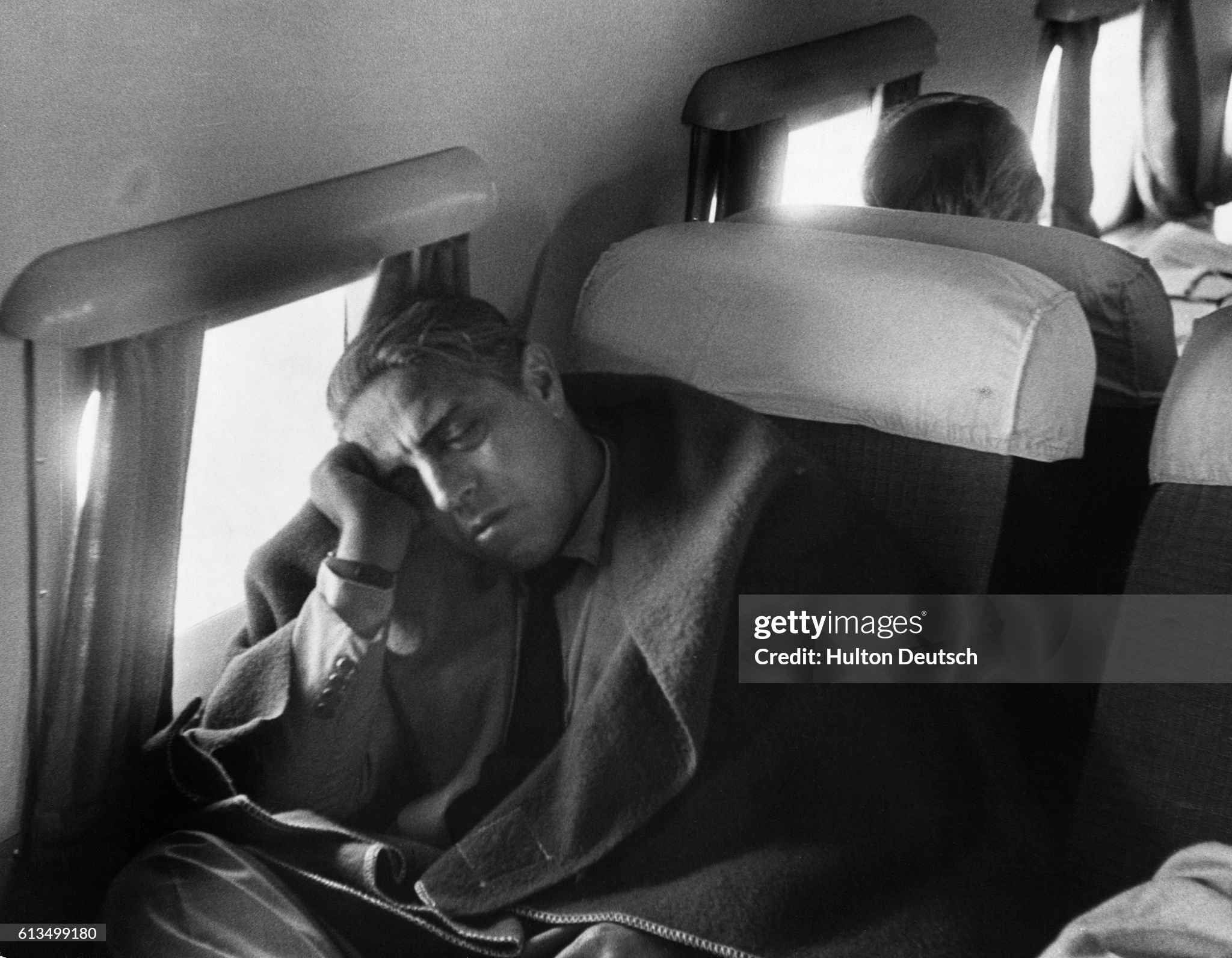 Aristotle Socrates Onassis sleeps whilst travelling in 1955. 