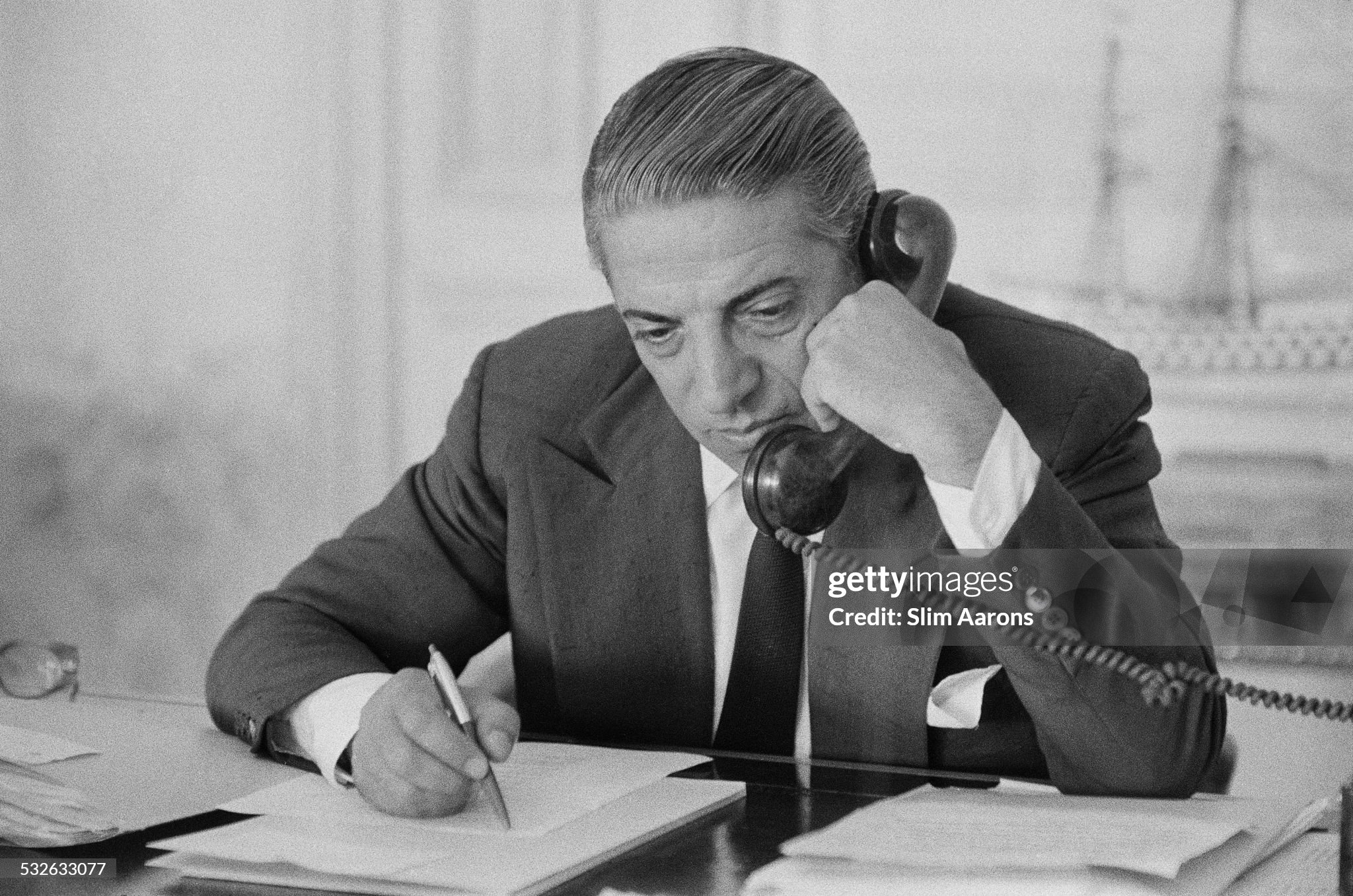 Greek shipping tycoon Aristotle Socrates Onassis in his Monte Carlo office in 1958. 