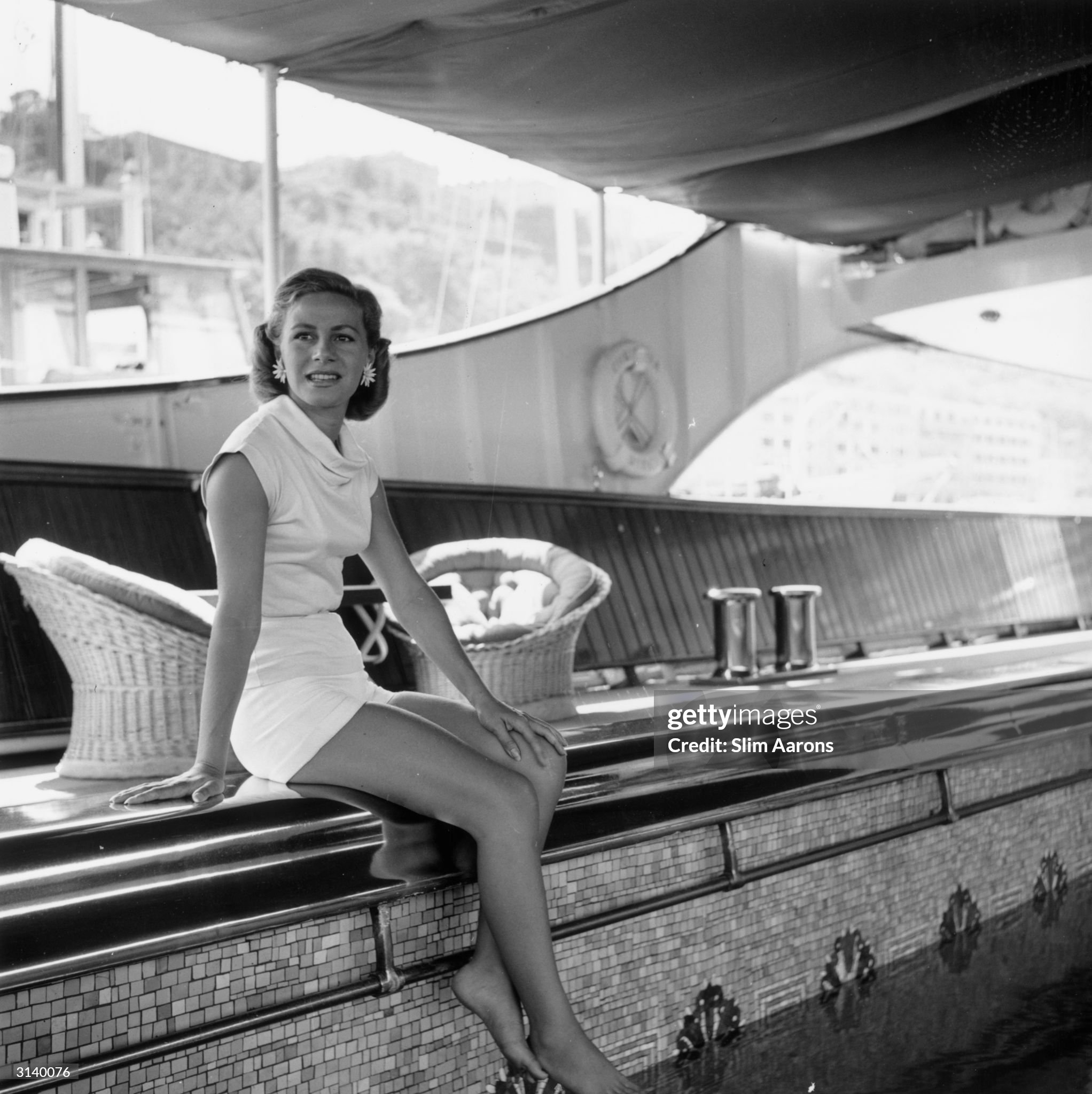 Athina Livanos Onassis relaxing by the swimming pool aboard the 'Christina' in Monte Carlo in 1958. 