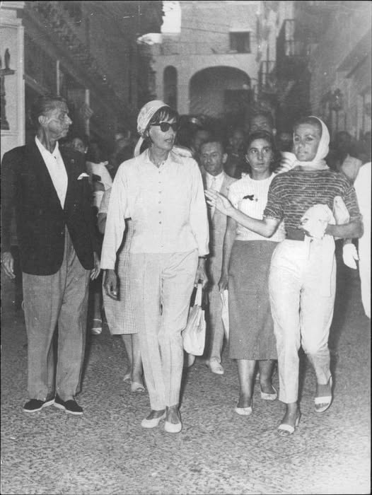 Greta Garbo, with George Schlee, walks in the streets of the isle of Capri on 31 August 1958.