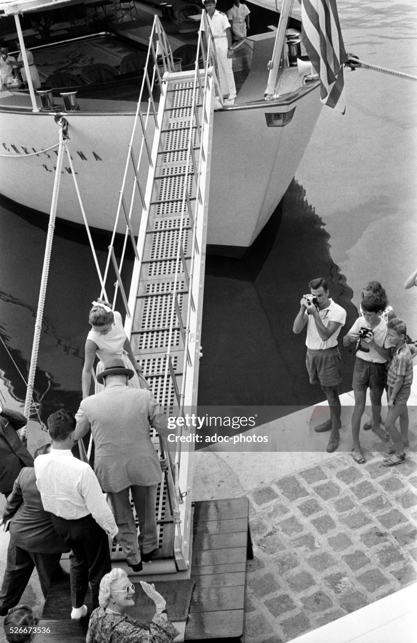 Christina Onassis welcomes Winston Churchill aboard Christina, yacht of the Greek shipping magnate Aristotle Onassis, in the port of Monaco in 1959. 