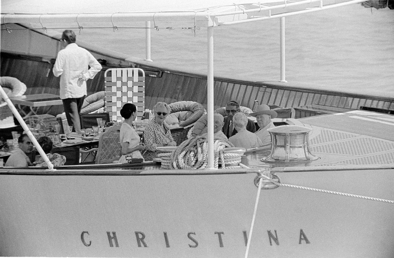 Aristotle Onassis and Winston Churchill with his wife on the yacht 'Christina' in Venice in 1960.