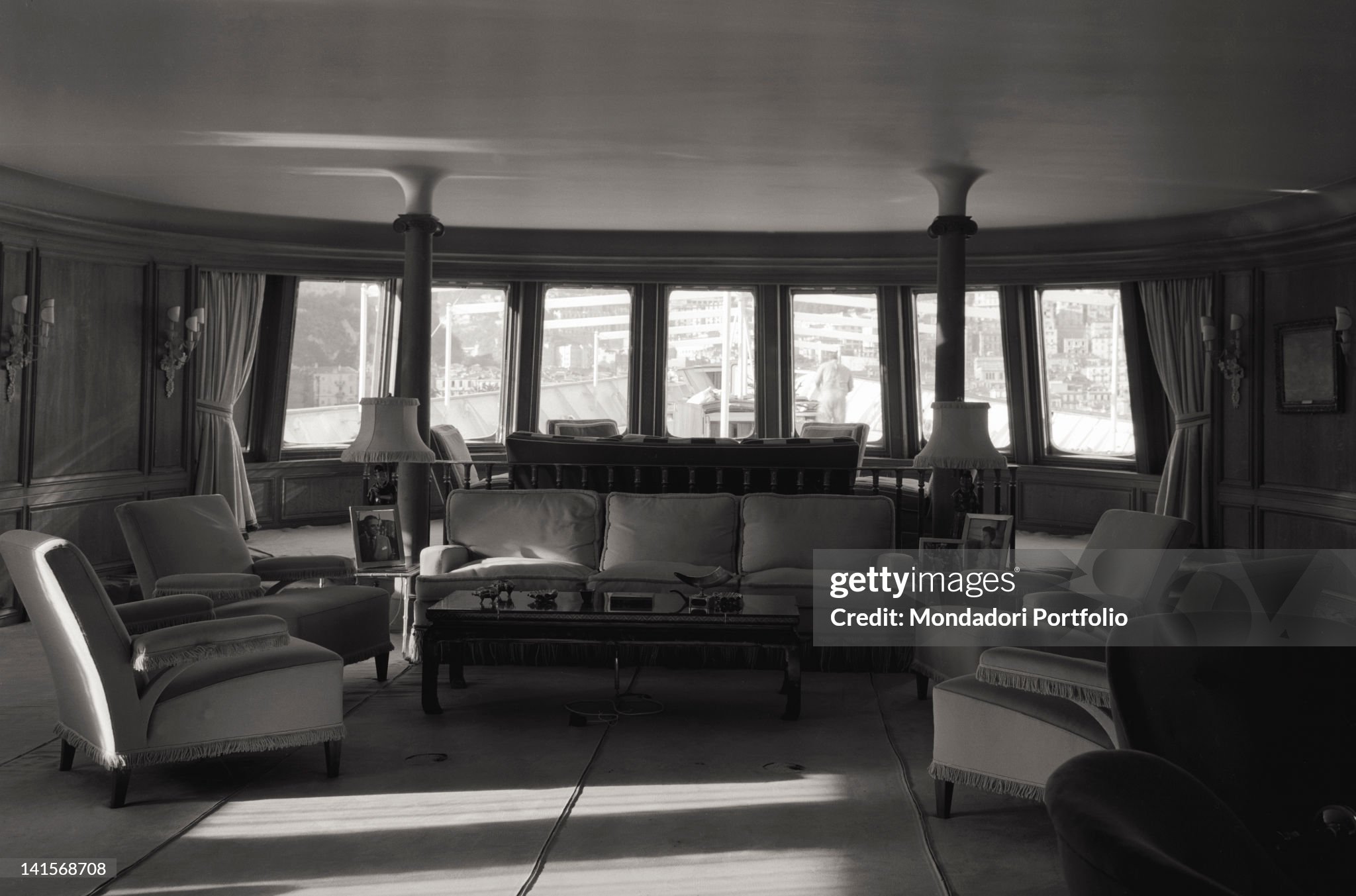 View of the drawing-room that leans on the bridge of the bow on board of the yacht 'Christina' of Aristotle Onassis in Monaco in June 1961. On the bedside table on the side of the sofa a photo of the Greek shipowner. 