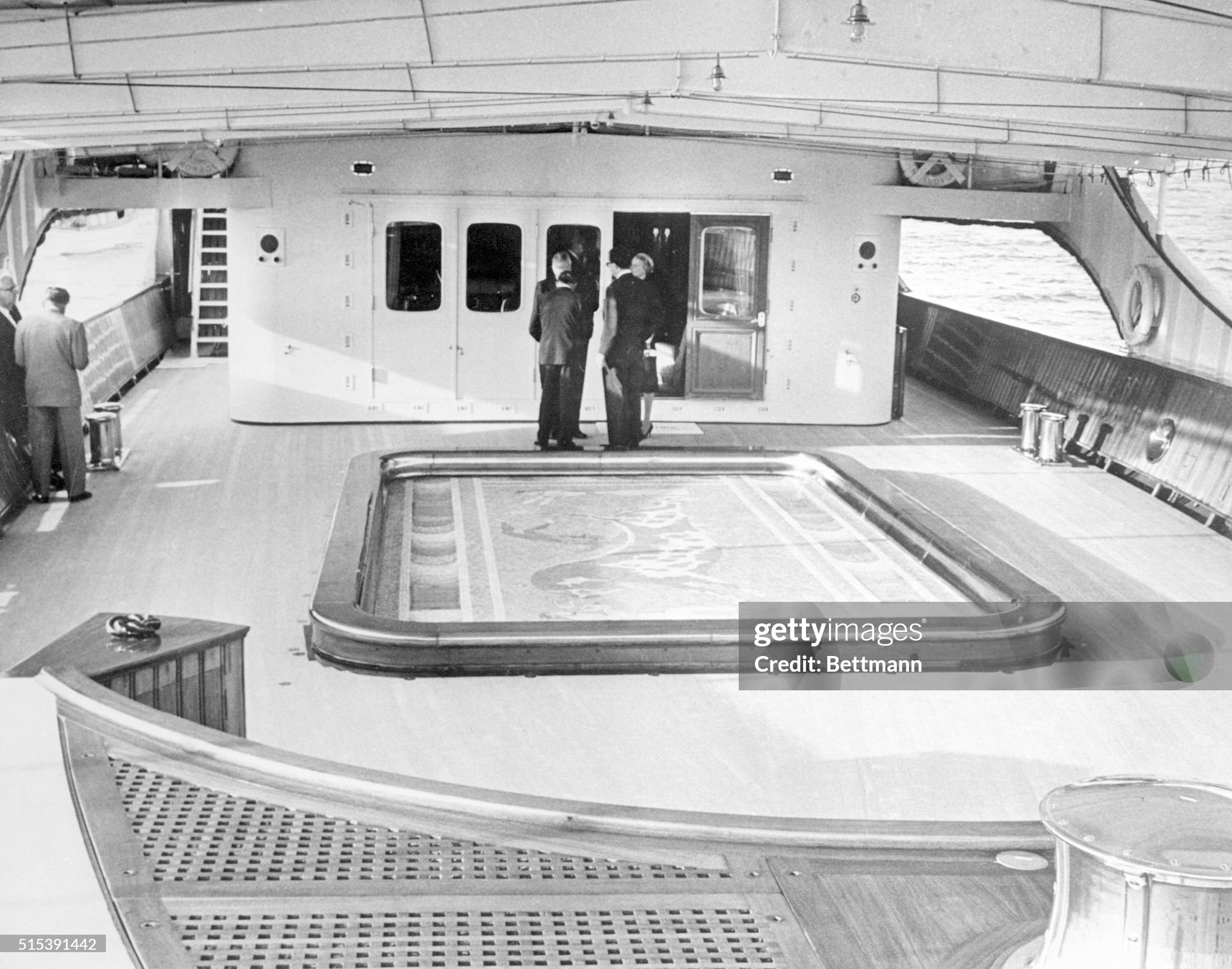 As shown here, the mosaic floor of the swimming pool aboard Aristotle Onassis' yacht ‘Christina’ may be raised to deck level when not in use. 