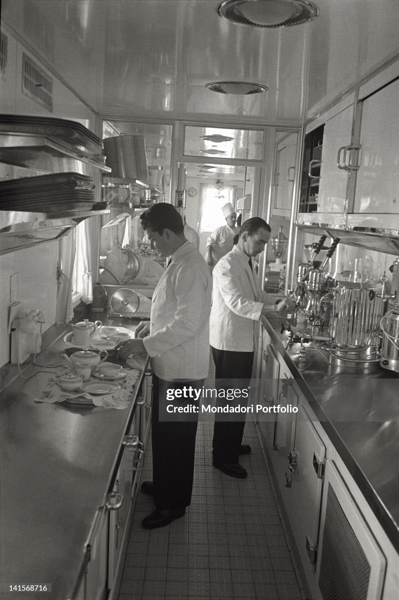 View of the kitchen on board on the yacht 'Christina', where waiters and chefs are very active for the guests of the shipowner. Montecarlo, June 1961. 