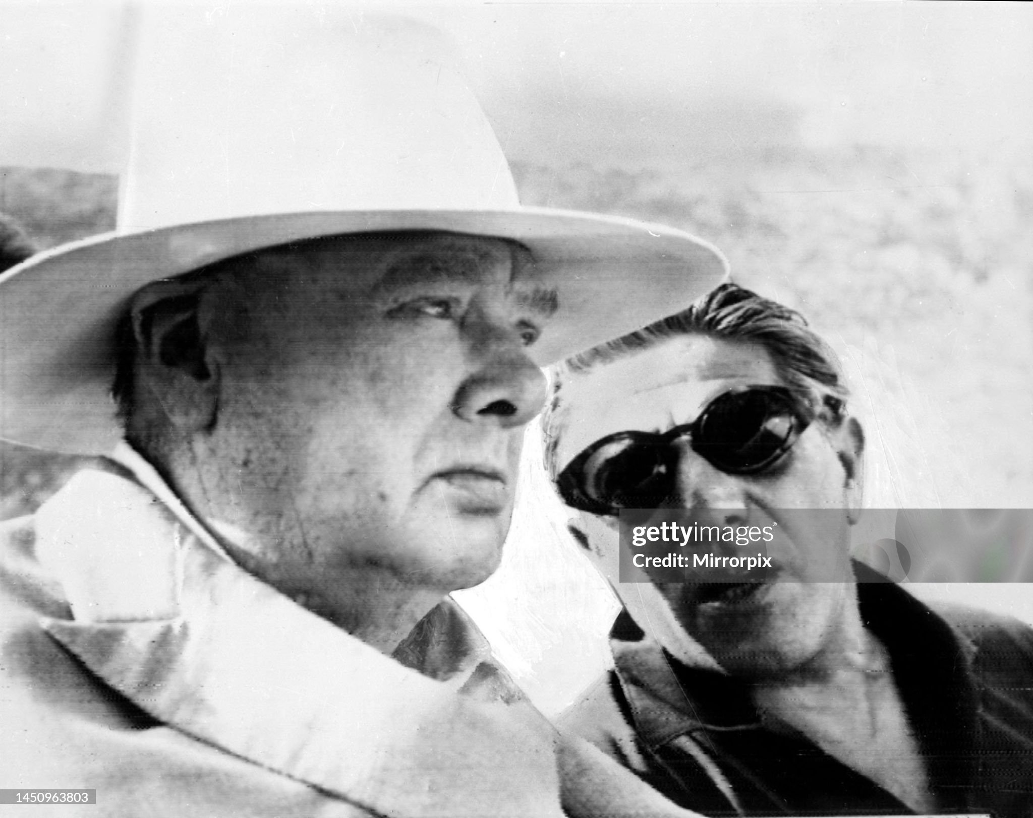 Winston Churchill leaving Nice airport with Aristotle Socrates Onassis in April 1962. 