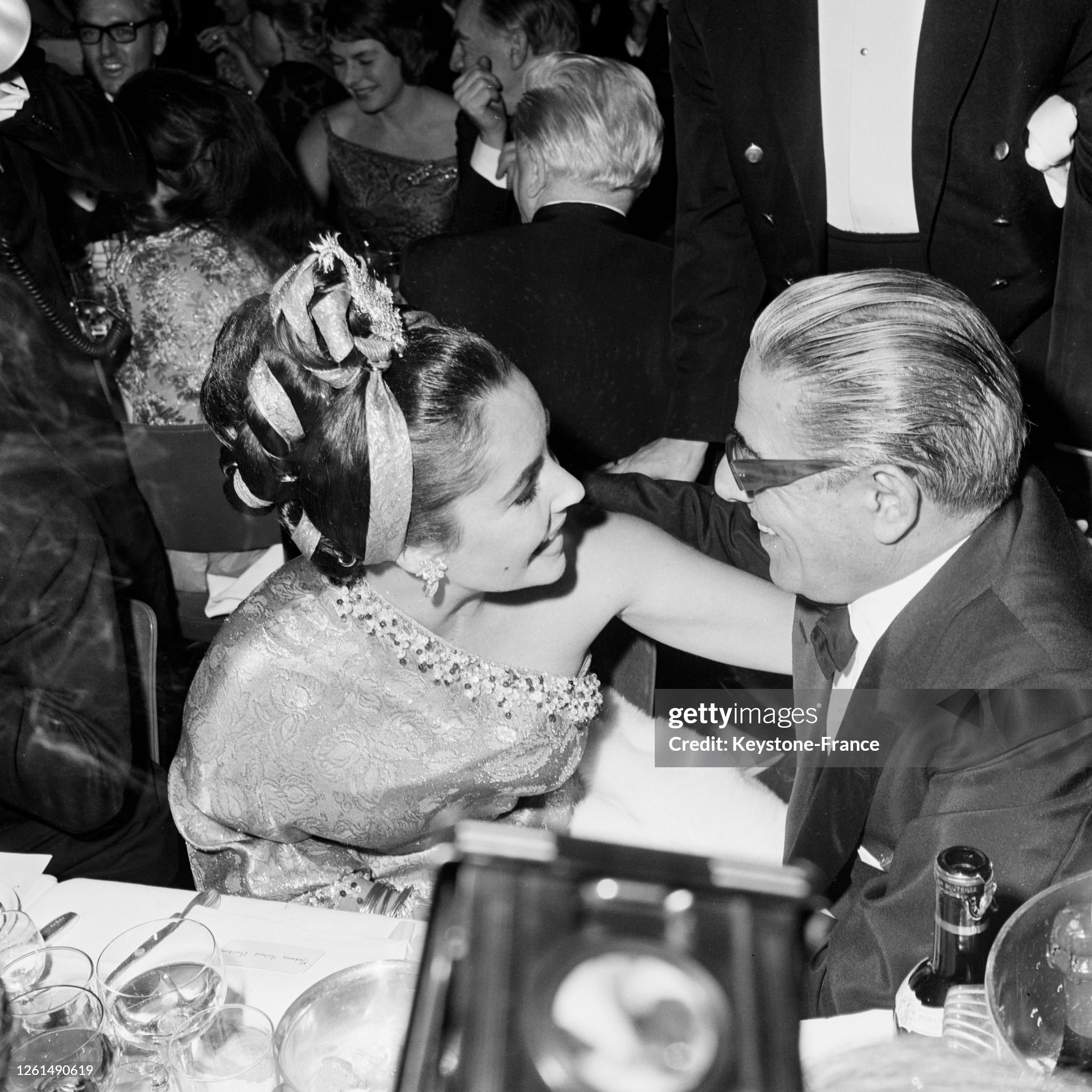 Liz Taylor and Aristotle Onassis chatting at the 'Lido' in Paris, France, on 02 December 1964. 