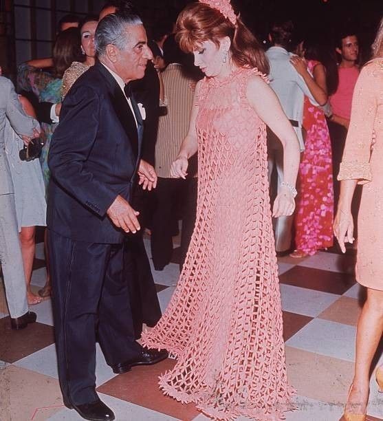 Greek shipping tycoon Aristotle Onassis dancing with Italian film star Gina Lollobrigida at a ball in Venice on 01 September 1967. 