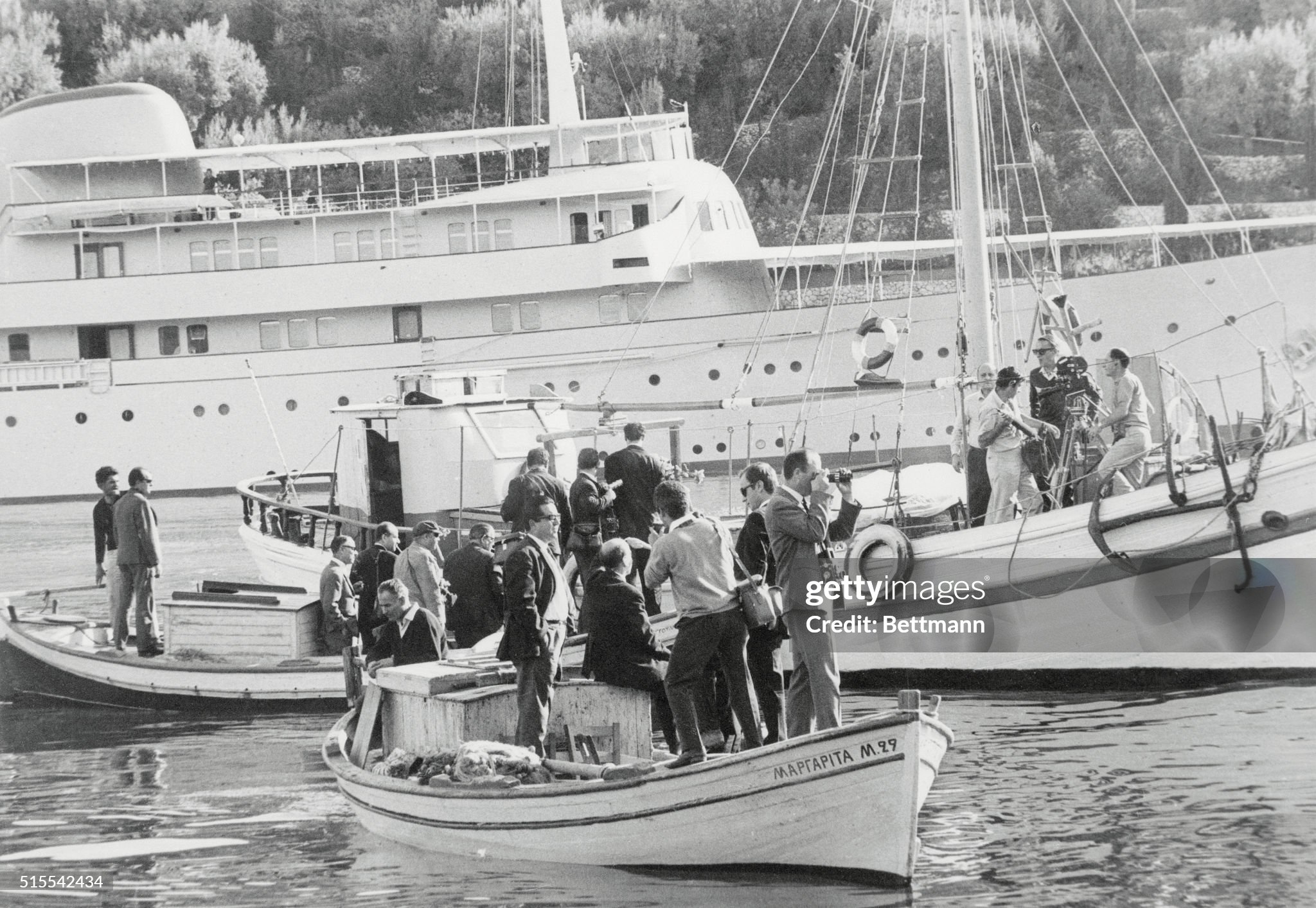 Newsmen sit in small boats off the shore of Skorpios, Aristotle Onassis' Ionian island, waiting for permission to land on the island for pictures and stories about the impending marriage of Onassis to Jacqueline Kennedy on 19 October 1968. 