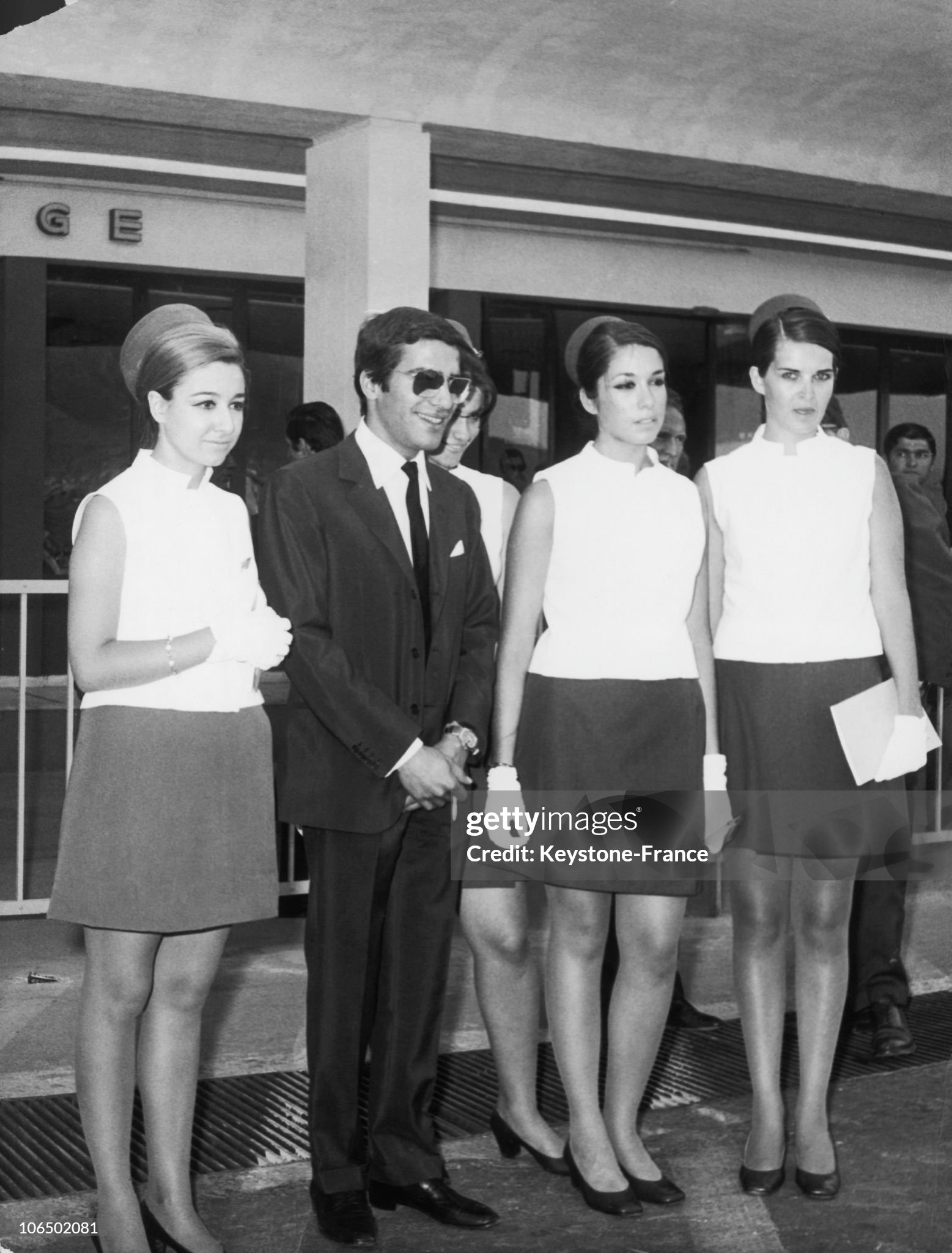Alexander Onassis posing with some stewardesses from the air company Olympic Airways on a press conference which he gave at the Athens Airport on 16 July 1969. 