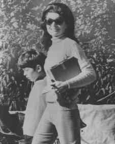 Suddenly noticing a Greek paparazzi snapping her and son with a telephoto lens on Skorpios provoked the new Mrs. Onassis to grimace more than smile.