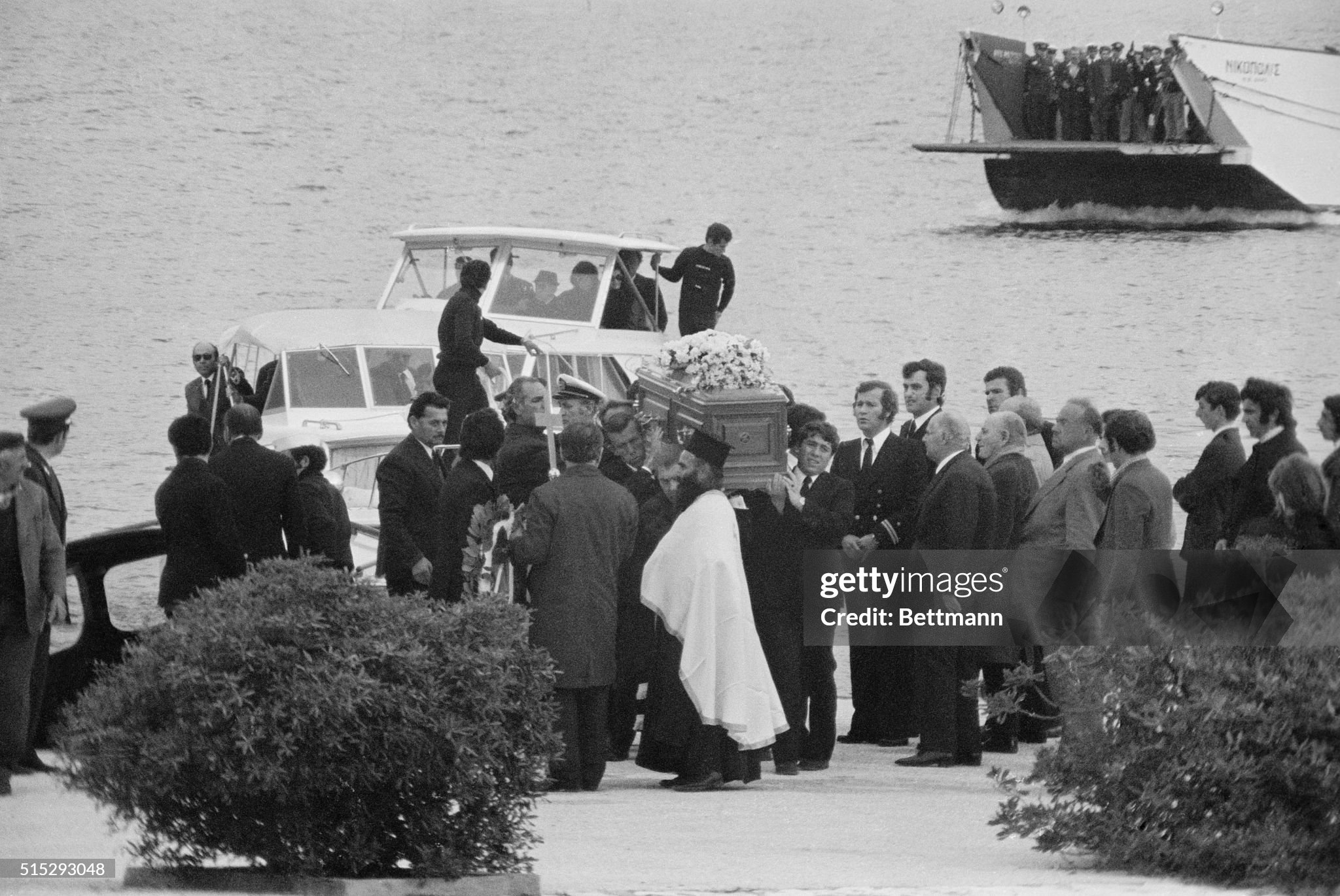 Pallbearers lift the coffin containing the body of Aristotle Onassis from a launch as a ferry with the family members arrives on the Greek millionaire's private island for funeral services and interment. Onassis died on 15 March 1975 in a Paris hospital. 