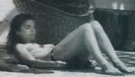 Mrs. Onassis laying in the sun, topless, as many women did, especially in Europe.