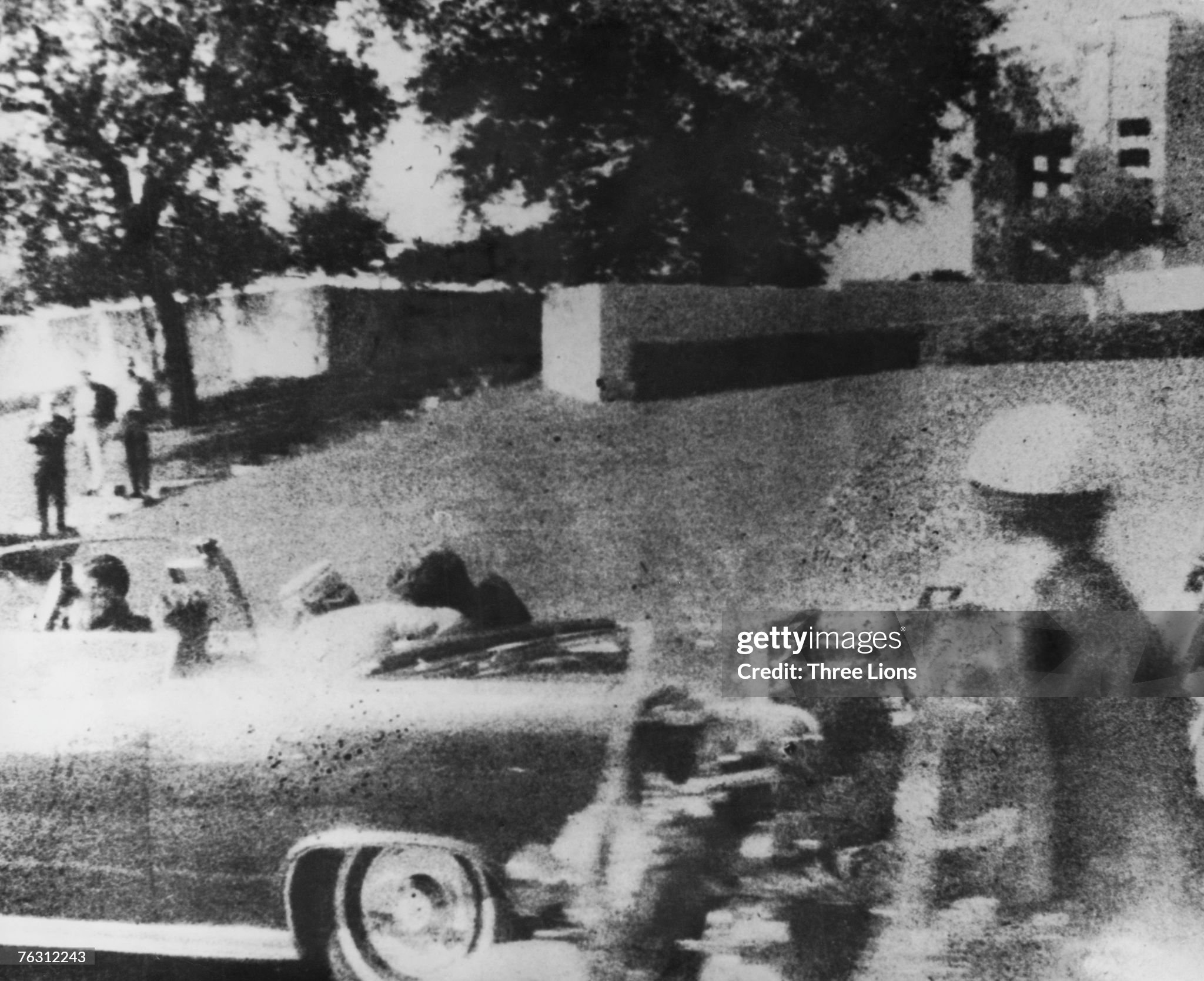 American president John F. Kennedy is struck by an assassin's bullet as he travels through Dallas in a motorcade on 22 November 1963. 