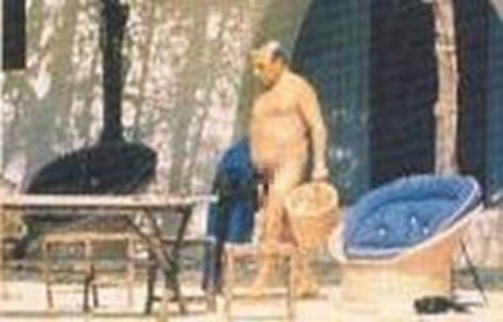 A naked Aristotle Onassis.