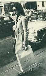 Jackie Onassis exiting Christian Dior shop in Paris.