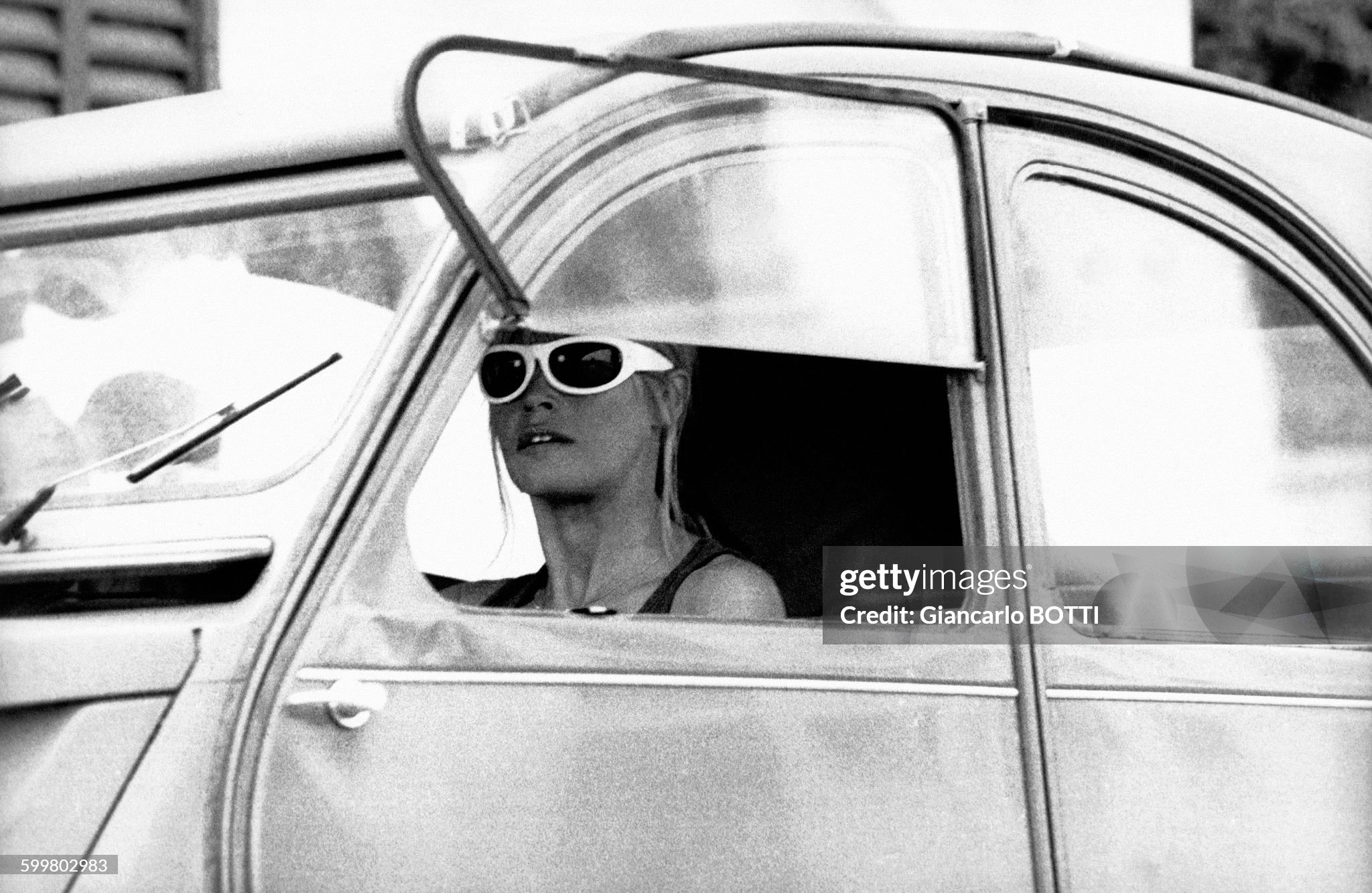 Brigitte Bardot driving her Citroën 2 CV in Saint-Tropez in August 1965. 