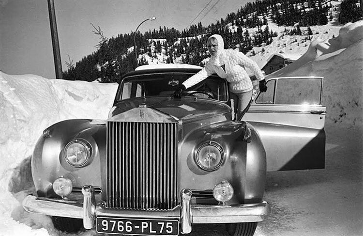 French actress Brigitte Bardot with her 1962 Rolls Royce Silver Cloud II by H.J. Mulliner en route to her vacation home in the French Alps in 1966.