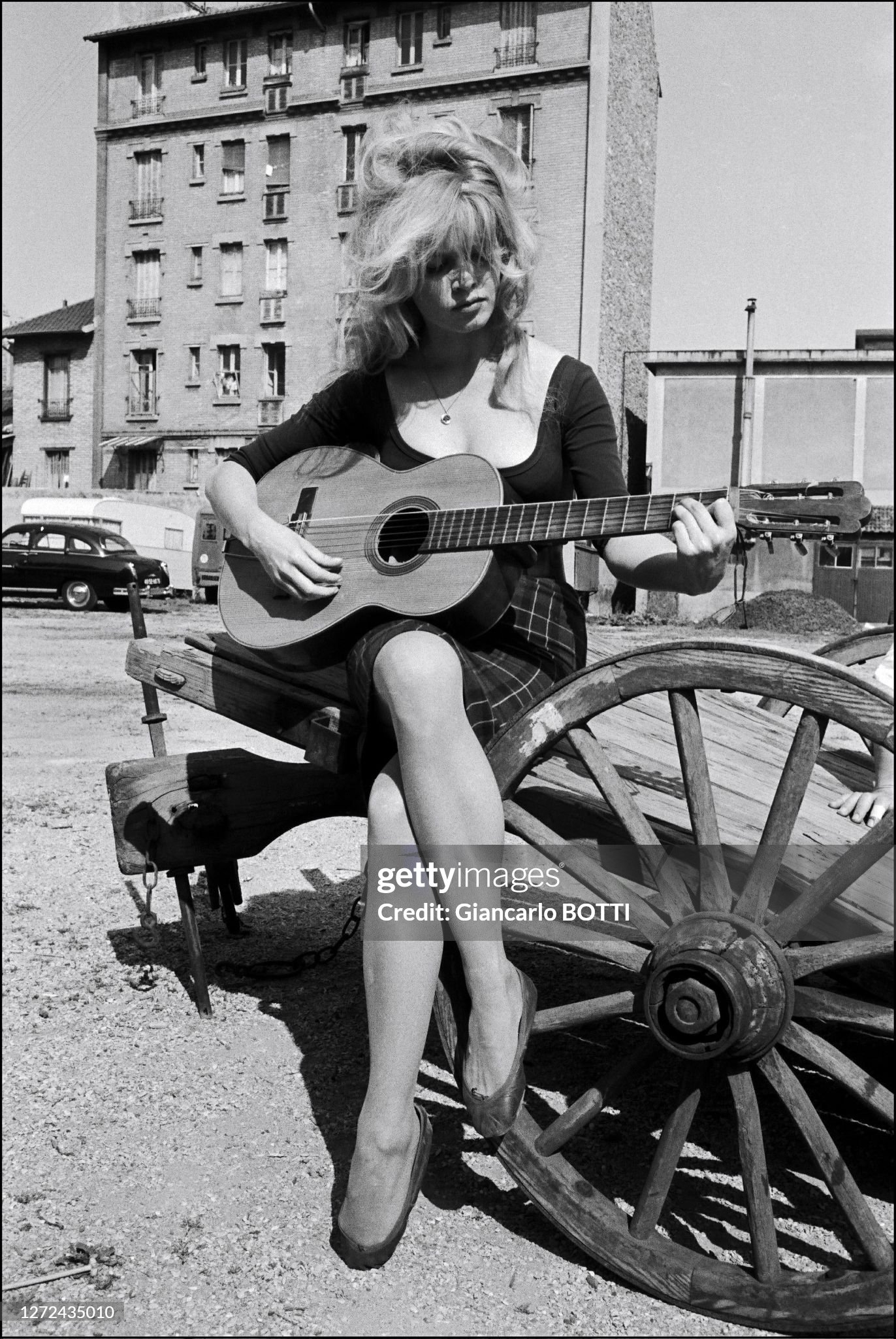 Brigitte Bardot playing guitar in Saint-Tropez in August 1966. 