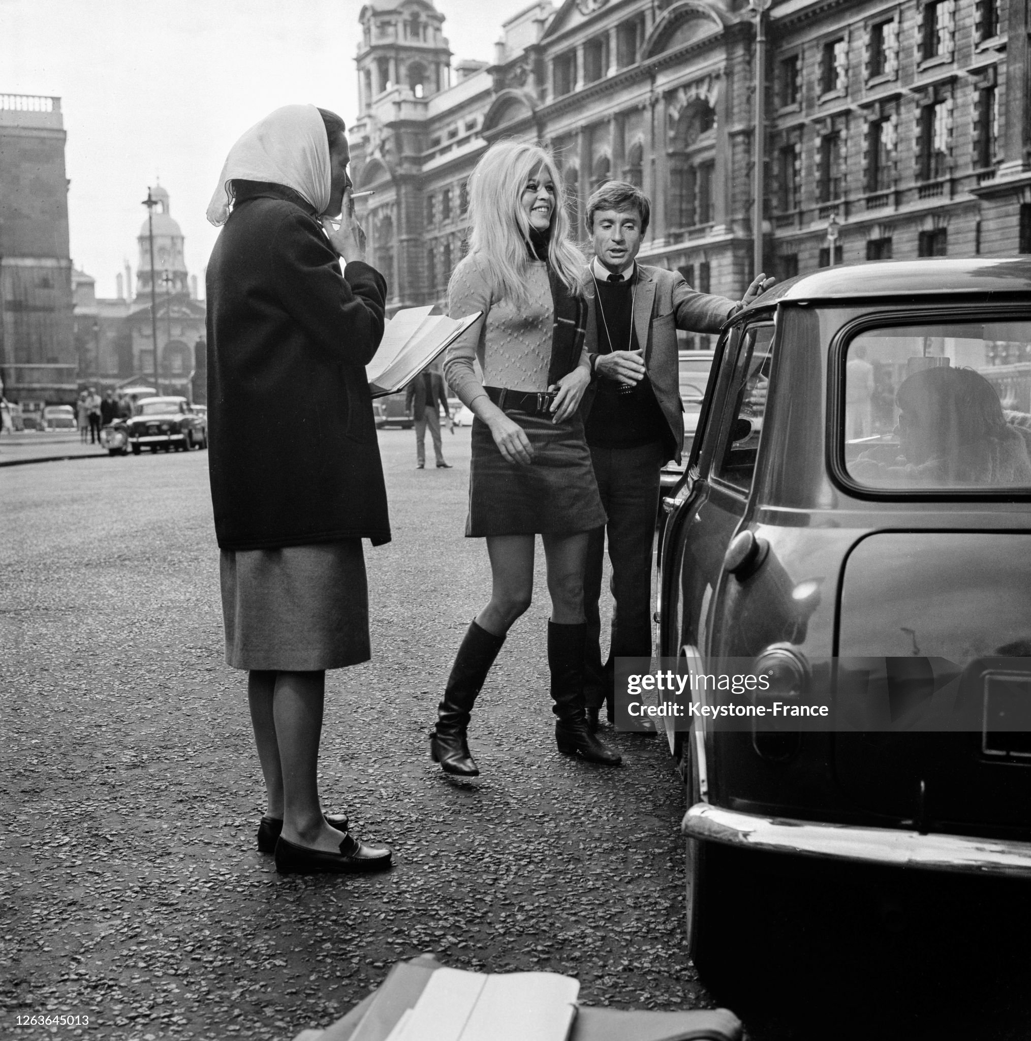 Brigitte Bardot and director Serge Bourguignon during the filming of 'A coeur joie' in the streets of London, UK, in 1966. 