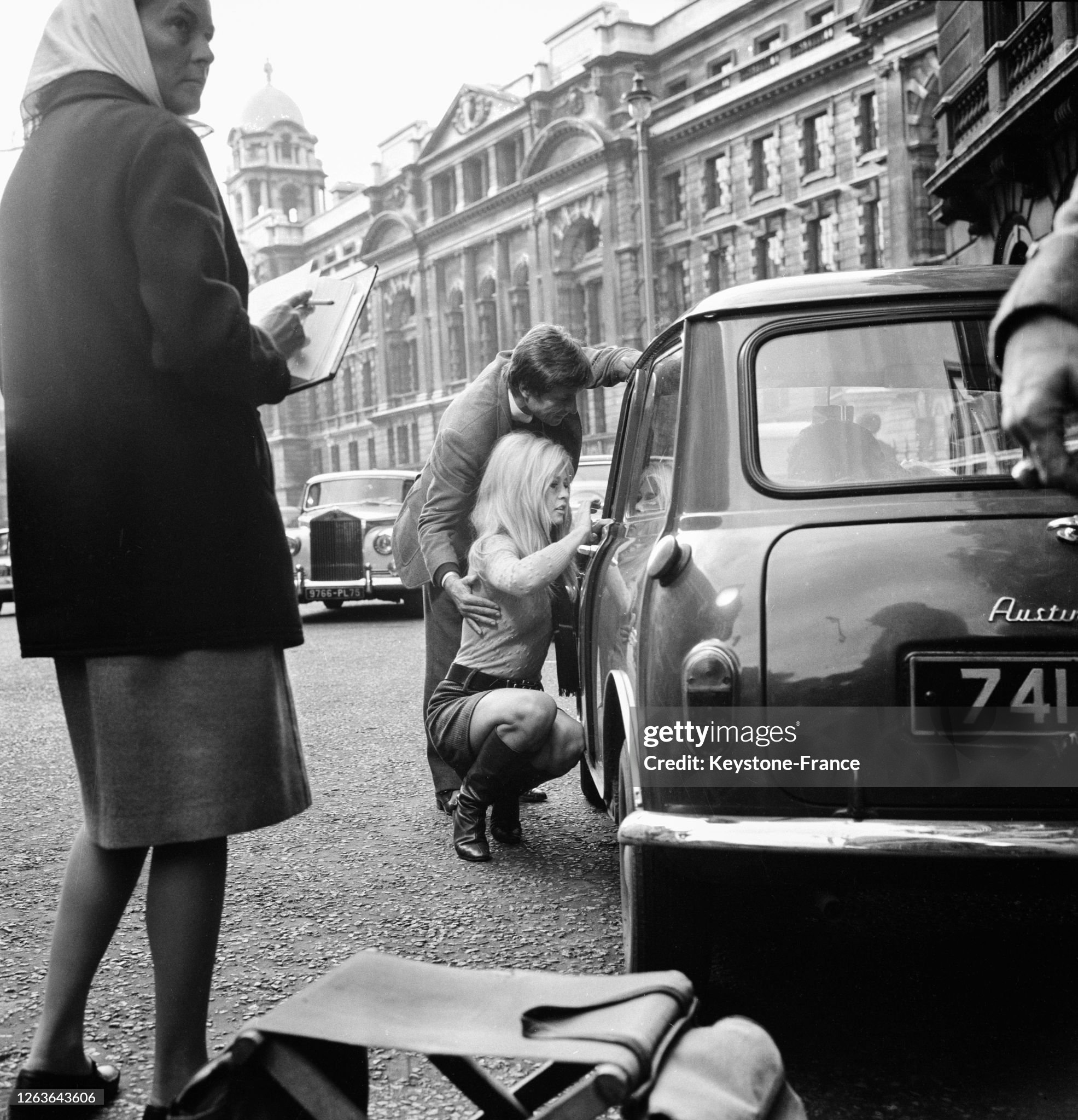 Brigitte Bardot and director Serge Bourguignon during the filming of 'A coeur joie' in the streets of London, UK, in 1966. 