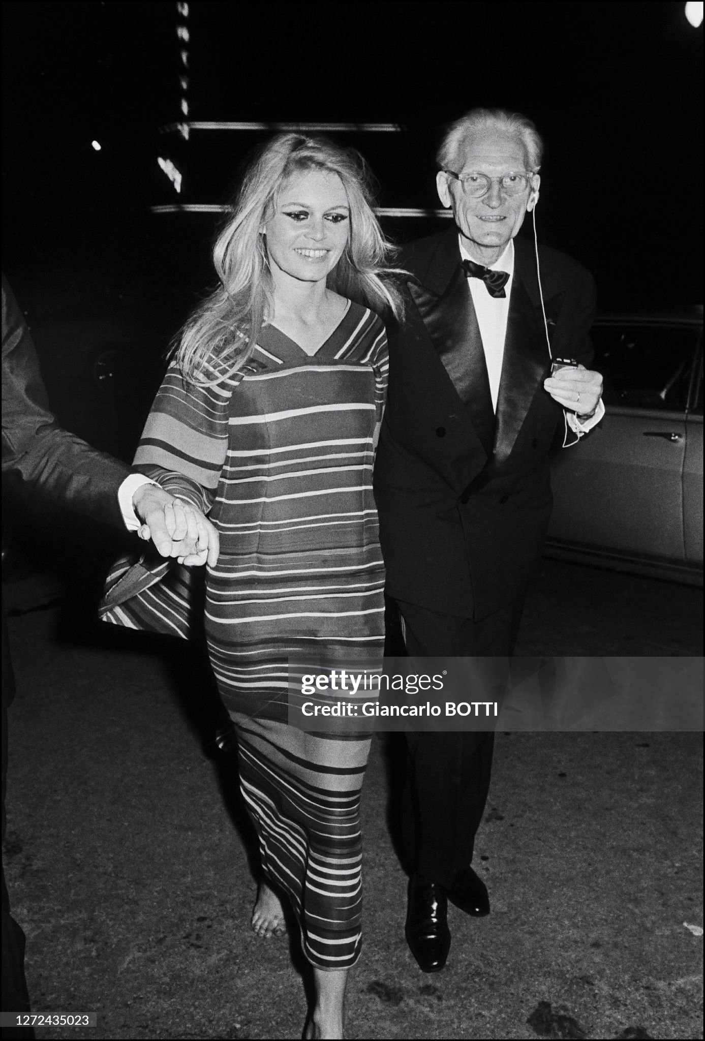 Brigitte Bardot and her father Louis Bardot enter the 'Mic Mac' party at Maxim's in Paris, France, in April 1967.