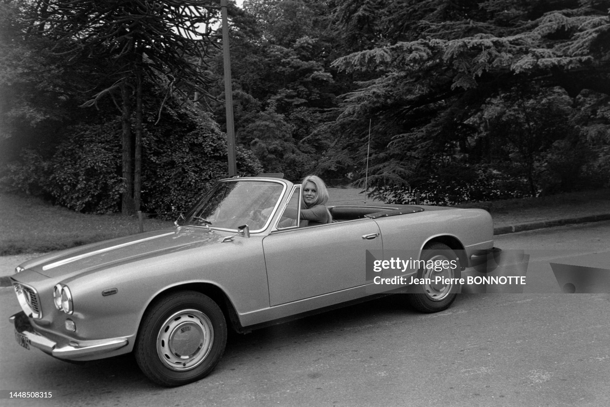 Brigitte Bardot in her 'Lancia Flavia' cabriolet in 1967. 
