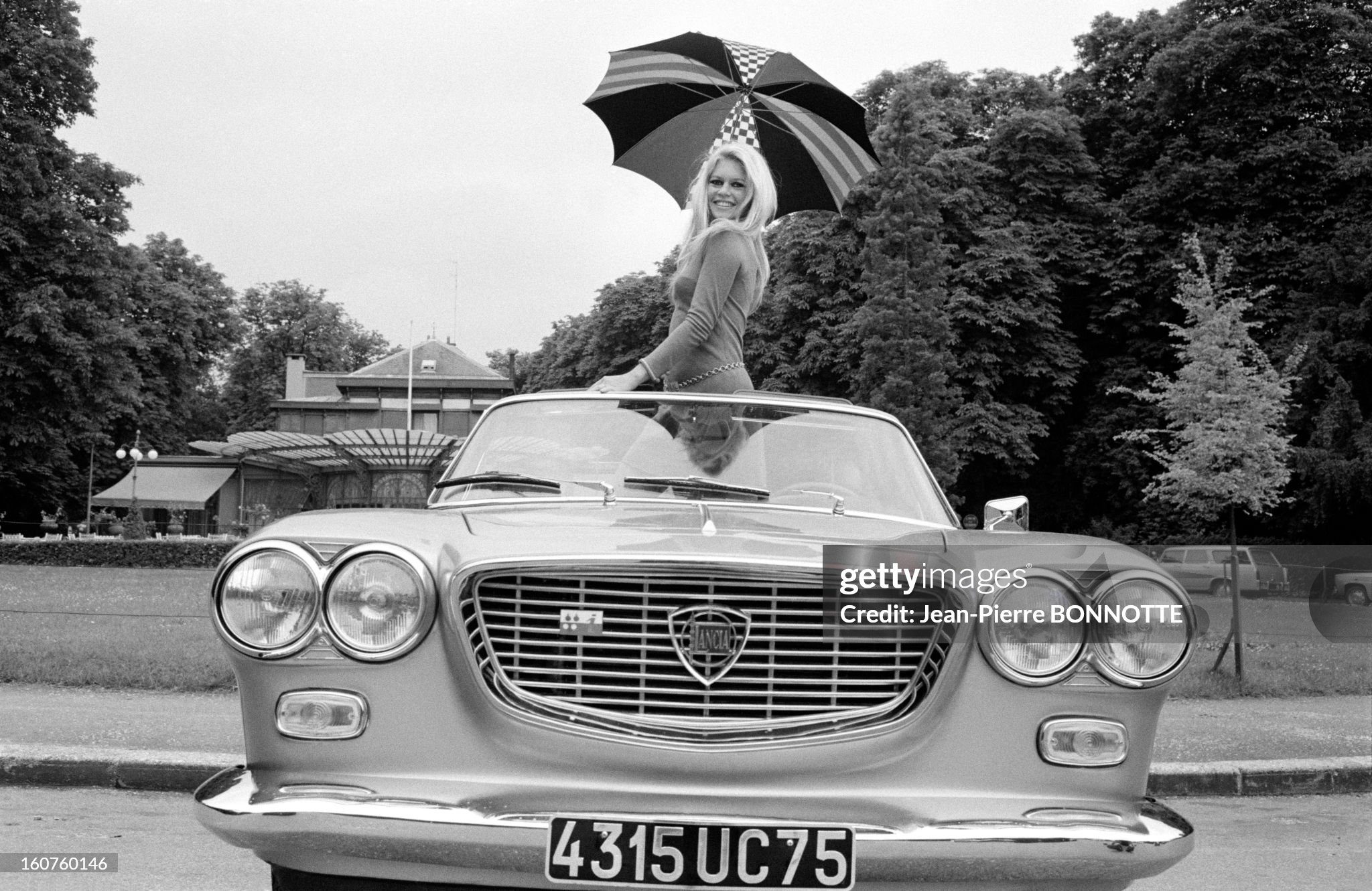 Brigitte Bardot in her 'Lancia Flavia' cabriolet in 1967. 