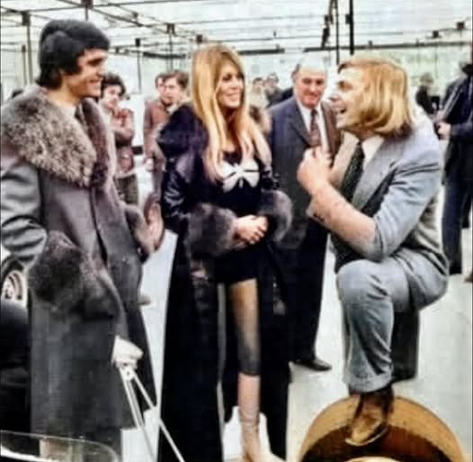 Brigitte Bardot with Francois Cevert and Johhny Servoz-Gavin at the 1971 Paris Motor Show in October 1971. 